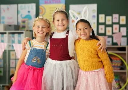 happy-girls-friends-and-hug-with-costume-in-class-2026-03-25-03-57-35-utc